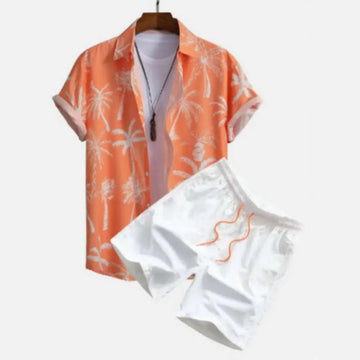 Orange palm print short sleeve beach shirt suit with white shorts and orange drawstring on a wooden hanger