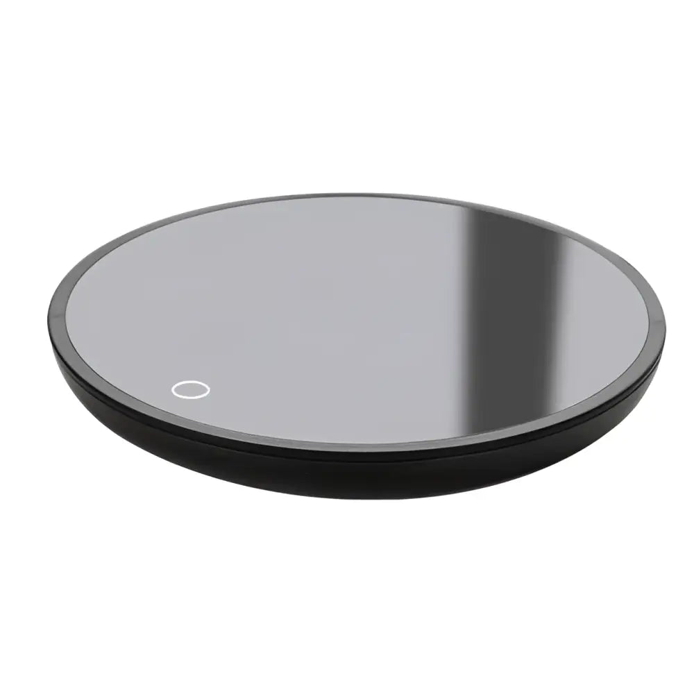 Black circular electric mug cup warmer with smooth reflective surface and subtle white indicator light for ornate glass mugs