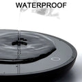 Black circular electric mug cup warmer with ornate glass design and magnetic levitation for tea and coffee