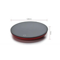Ornate glass mug cup warmer with a red and black circular electric matte finish pad for tea and coffee