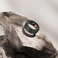 Black oura ring 3rd gen with sleek silicone protector case and illuminated red and green display lights