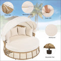 Beige wicker outdoor patio rattan round daybed with removable cushion cover and adjustable feet for patio use
