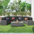 Dark gray wicker outdoor round sofa set with black cushions and accent pillows for comfortable outdoor seating