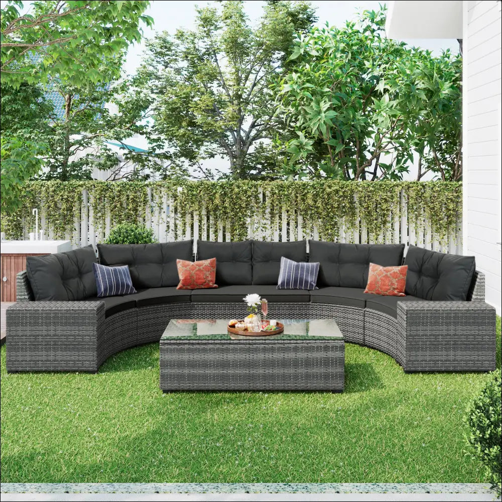 Dark gray wicker outdoor round sofa set with black cushions and accent pillows for comfortable outdoor seating