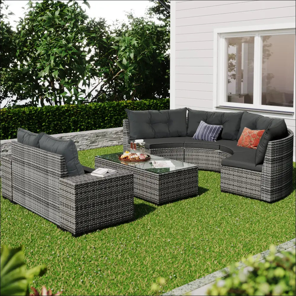 Gray woven wicker round sofa set with dark gray cushions and decorative throw pillows for outdoor use