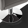 Gray leather salon chair with polished chrome base and circular footrest on high-density foam black semi-circular salon mat featuring outer circle design