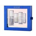 The outset everyday radiance set in a blue gift box features four glass bottles to reduce expression lines, perfect gift for all skin types