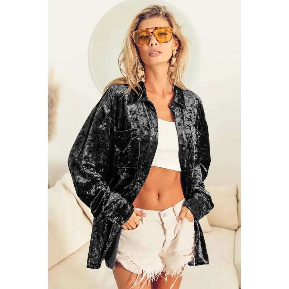 Oversized black long sleeve velvet shirt with relaxed fit and button-front design in sleeve velvet shirt style