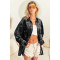 Oversized black long sleeve velvet shirt with relaxed fit and button-down front in soft sleeve velvet fabric
