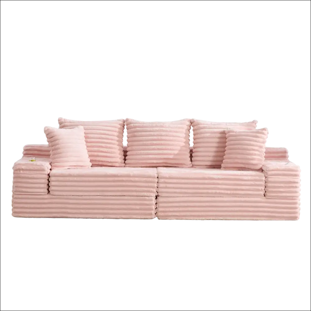 Pink oversized boneless four seats sofa in corduroy with ribbed texture and matching pillows for comfortable seating