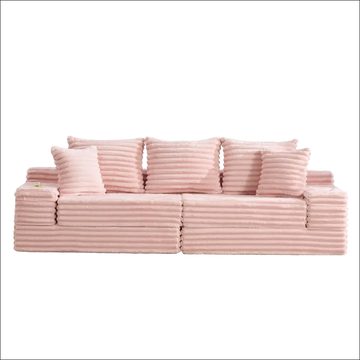 Pink oversized boneless four seats sofa in corduroy with ribbed texture and matching pillows for comfortable seating