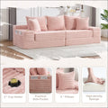 Oversized boneless four seats sofa in pink ribbed corduroy fabric with matching pillows and built-in cup holders