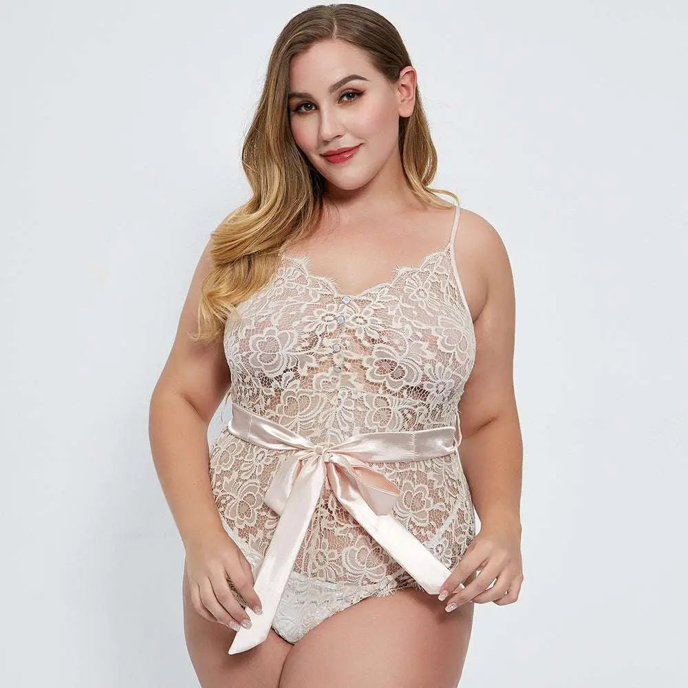 Delicate beige oversized lace bodysuit with floral pattern and satin ribbon belt tied in a bow at the waist