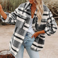A cozy oversized plaid button flannel woolen shirt in black white and gray with buttoned chest pockets