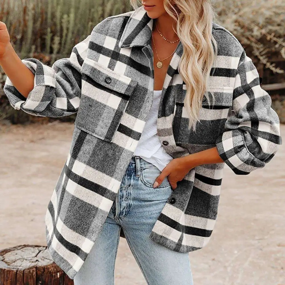 A cozy oversized plaid button flannel woolen shirt in black white and gray with buttoned chest pockets