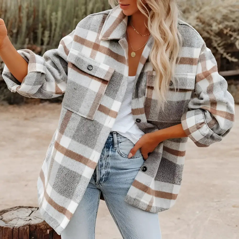 A cozy oversized plaid button flannel woolen shirt in gray and beige with buttoned chest pockets