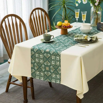 Palace flowers table cloth and runner sets featuring a green and cream floral runner with subtle sheen on off-white cloth