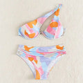 Pastel abstract bikini featuring a one-shoulder design with orange pink and blue geometric patterns fashion split swimsuit