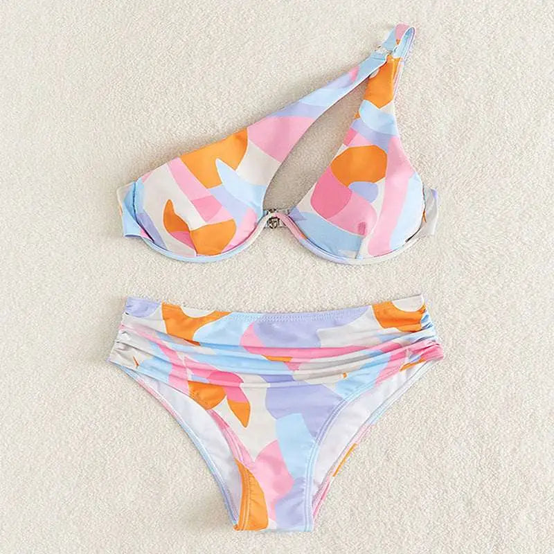 Pastel abstract bikini featuring a one-shoulder design with orange pink and blue geometric patterns fashion split swimsuit