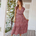 A flowing red and white floral summer dress with ruffle cap sleeves and short ruffled sleeves perfect for summer wear