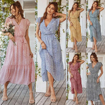 A flowing pastel floral summer dress with v-neckline, ruffle cap sleeves, and tiered hem perfect for warm weather