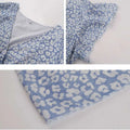 Light blue pastel floral summer dress with ruffle cap sleeves and white floral pattern perfect for warm weather