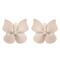 Beige leather butterfly bag clip children’s barrettes made of smooth leather with subtle sheen and white fabric ties