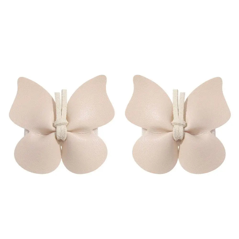 Beige leather butterfly bag clip children’s barrettes made of smooth leather with subtle sheen and white fabric ties
