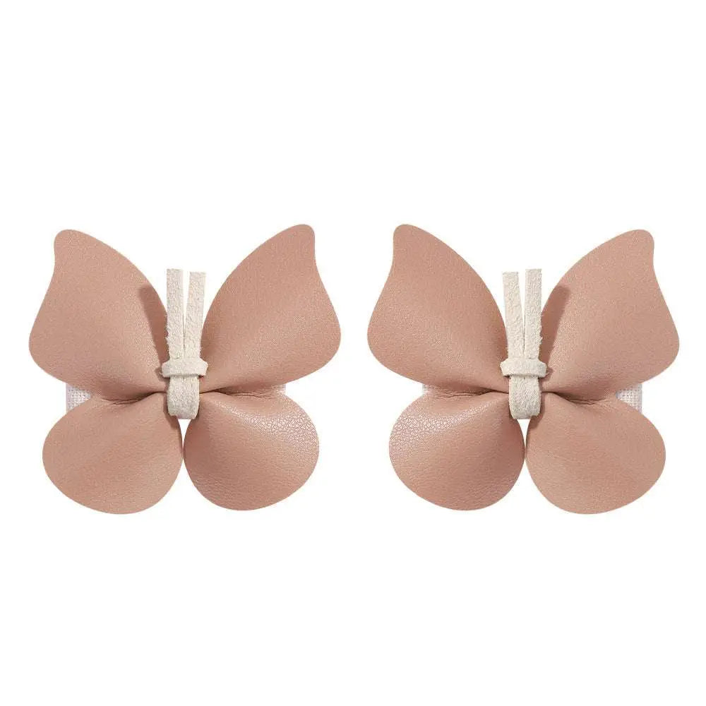 Pair of blush pink butterfly-shaped adhesive bra clips with white lace trim for pastel leather butterfly bag clip children’s barrettes