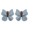 Light blue leather butterfly bag clip children’s barrettes with brown leather ties for pastel accessory styling