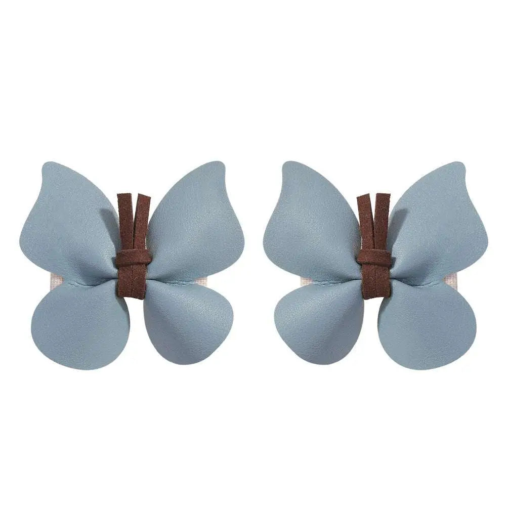 Light blue leather butterfly bag clip children’s barrettes with brown leather ties for pastel accessory styling