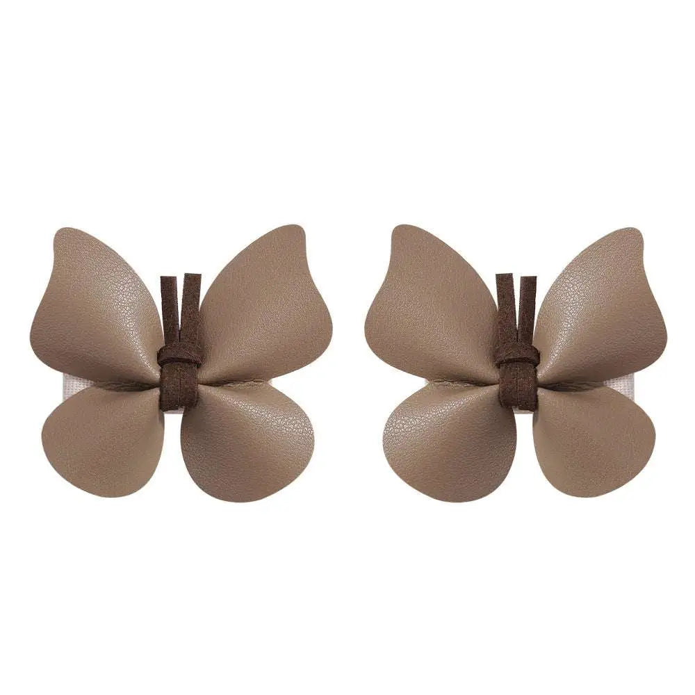Beige leather butterfly bag clip children’s barrettes with dark brown fabric ties for stylish hair styling