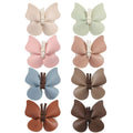 Pastel leather butterfly bag clip children’s barrettes in earth tones with faux leather and central tie closure