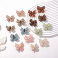 Pastel leather butterfly bag clip children’s barrettes in soft leather with brown centers for a green leather butterfly look