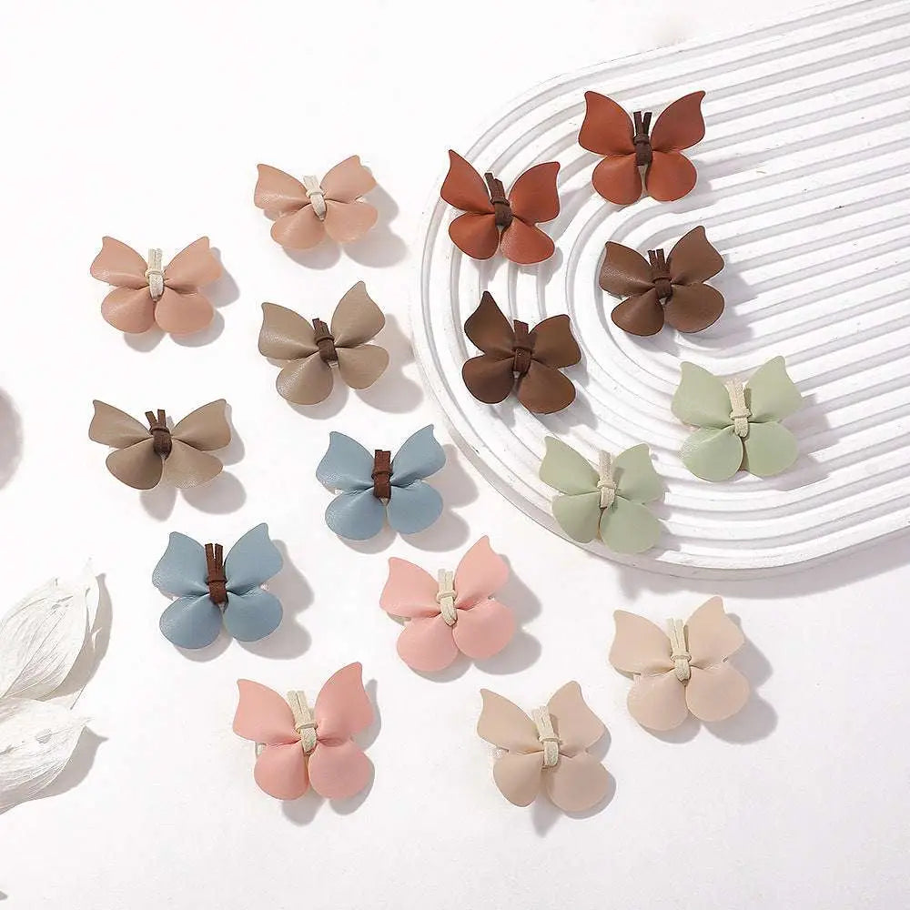 Pastel leather butterfly bag clip children’s barrettes in soft leather with brown centers for a green leather butterfly look