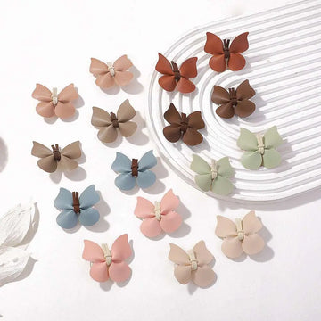 Pastel leather butterfly bag clip children’s barrettes in soft leather with brown centers for a green leather butterfly look