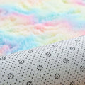 A soft white fabric living room carpet with a subtle black floral pattern in pastel rainbow nordic diameter round shape