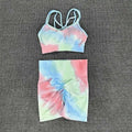 Pastel tie dye crop bra and high waisted shorts workout set with crisscross straps and ruched waistband