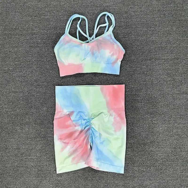 Pastel tie dye crop bra and high waisted shorts workout set with crisscross straps and ruched waistband