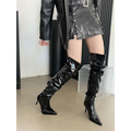 Black patent leather thigh high boots with glossy finish and autumn stiletto heel pointed heels
