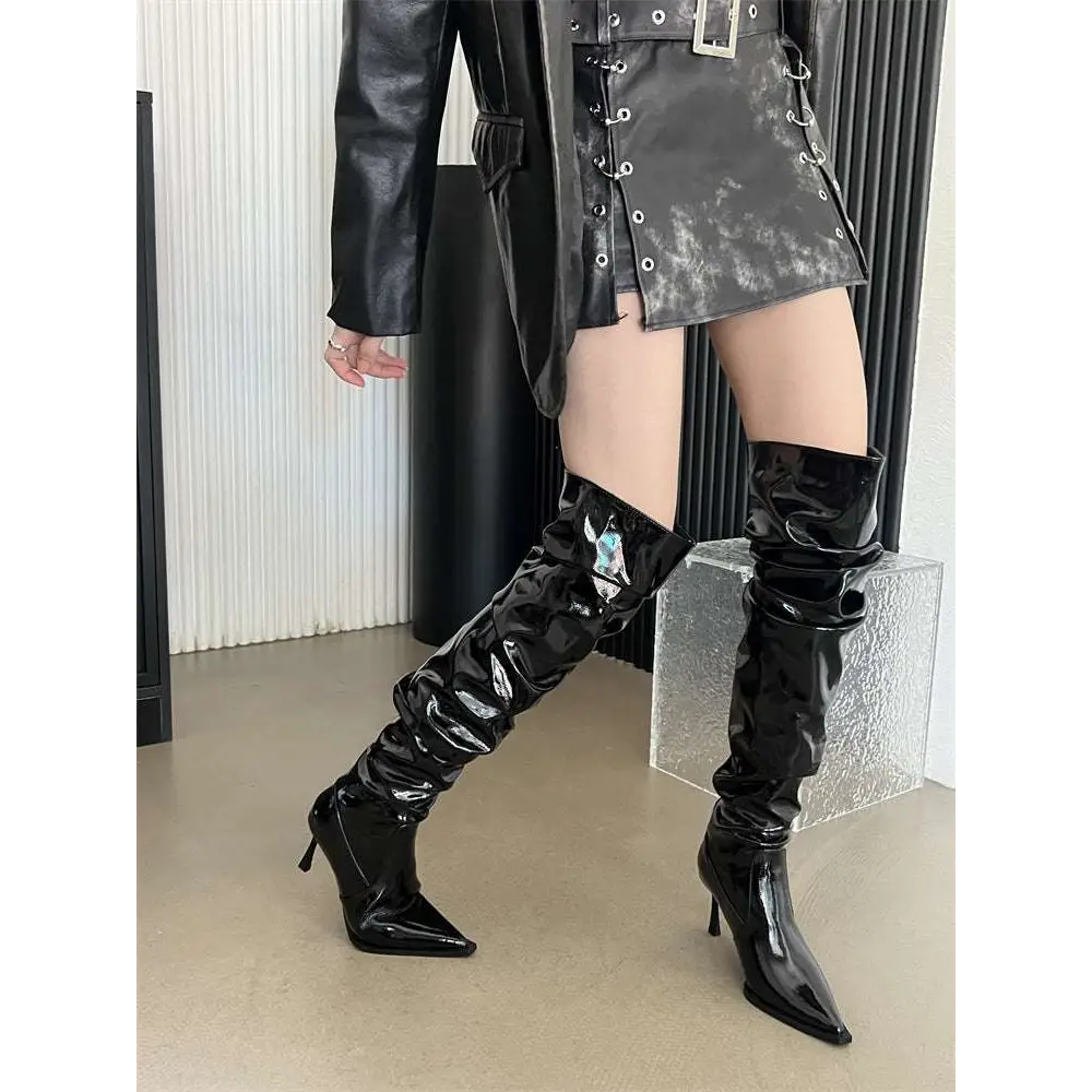 Black patent leather thigh high boots with glossy finish and autumn stiletto heel pointed heels