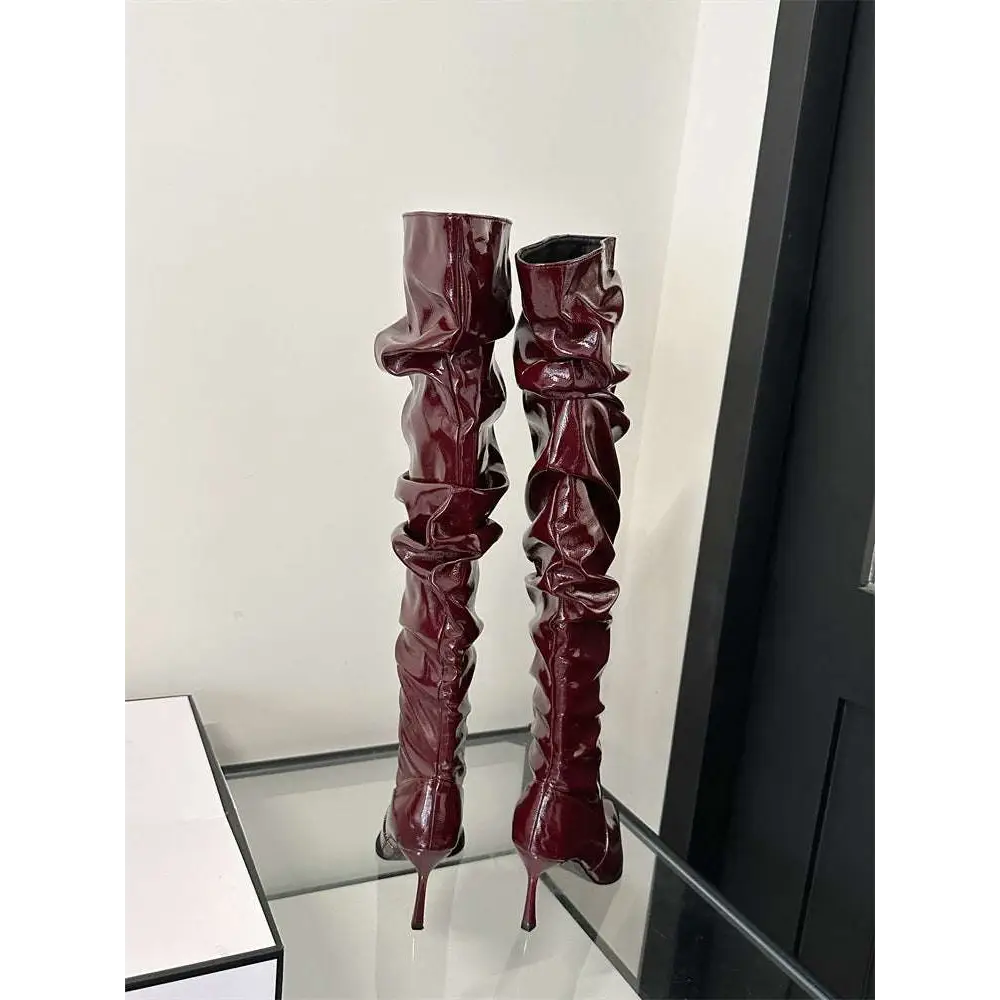 Burgundy patent leather thigh high boots with ruched detailing and autumn stiletto heel high stilettos