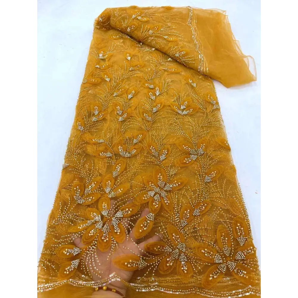 Golden sheer peach ribbon flower beaded tulle lace fabric with intricate floral embroidery and sparkling beading