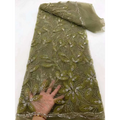 Olive green sheer flower beaded tulle lace fabric with intricate floral embroidery and sparkling beading peach ribbon flower