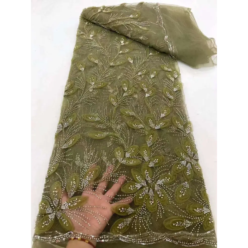 Olive green sheer flower beaded tulle lace fabric with intricate floral embroidery and sparkling beading peach ribbon flower