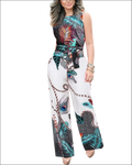 A vibrant sleeveless jumpsuit with bold teal black and red peacock feather print on white base fabric