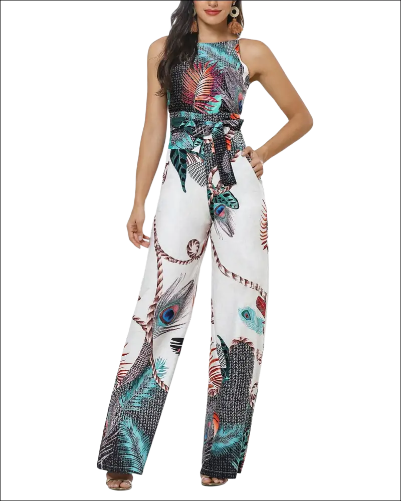 A vibrant tropical peacock feather print jumpsuit with halter neckline wide-leg design and tied waistband in teal black red and white