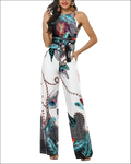White sleeveless jumpsuit featuring a vibrant teal black and orange peacock feather print for stylish wear