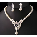 Pearl and crystal bridal ornaments jewelry set with cream pearls and silver crystal floral design for wedding gowns and bow pendant