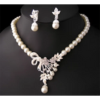 Pearl and crystal bridal ornaments jewelry set with cream pearls and silver crystal floral design for wedding gowns and bow pendant